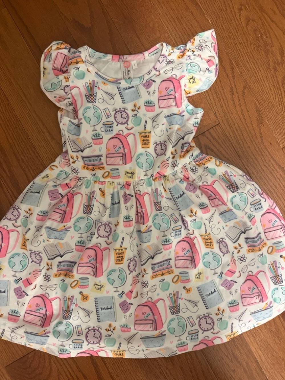 Girls White Dress with Pink School Print Backpack Motif